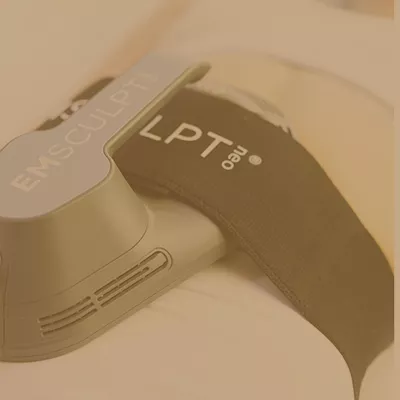 Emsculpt neo LPT body sculpting device used on a human body